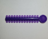 Лигатура эластичная на модуле Hestia пурпурная (Purple) 26 колец фото в интернет-магазине Дентаурум